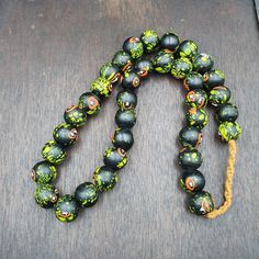 Vintage Trade Floral Green, Black Glass Beads Beaded Necklace vintage African Trade GLASS Beads Beaded Necklace Strand  * BEADS:APPROXIMATELY 36 PCS * Size: 17.5-18mm * Color : Multi Color * Full Strand     INFORMATION                        SHIPPING,PAYMENT,                        RETURN,FEEDBACK 1:We Freely Ship all our items to all over the world via USPS OR Airmail Register Thailand with providing tracking numbers 2:we ship worldwide within 2 business days after receiving cl Spiritual Black Beaded Bracelets For Beach, Black Artisan Necklaces For Beach, Black Artisan Necklace For Beach, Black Beaded Jewelry For Beach, 8mm Beads, Artisan Black Necklace For Beach, Artisan Black Jewelry For The Beach, Black 8mm Beads Beach Jewelry, Black Beaded Bracelets With Large Beads For Beach, Black Beach Jewelry With 8mm Beads