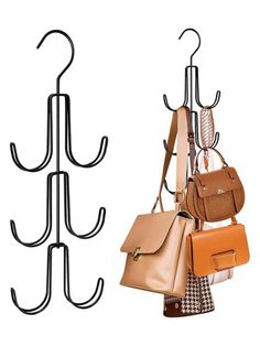 two purses and one handbag hanging on a coat rack with hooks for coats