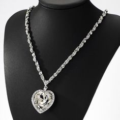 This high quality sterling silver Italian made chain features diamond cut moon shape cuts into the beads. This incredible detailing gives you a unique sparkle and shine once the light hits the chain. Its a small 2mm size chain that's good for mini or micro pendants. This chain is rhodium plated and gives you the exact look and feel of a white gold chain. Precious shiny added thanks to the round stone and the following 16x16mm heart cut moissonite below 925 Sterling Silver (Rhodium Plated) 2mm Wi Silver Heart Pendant Chain Necklace For Party, Silver Crystal Heart Necklace For Wedding, Heart Pendant Diamond Jewelry For Party, Silver Chain Necklace With Heart Pendant For Party, Diamond Heart Pendant Jewelry For Party, Diamond Heart Pendant For Party, Elegant Silver Crystal Heart Necklace, Silver Heart-shaped Crystal Jewelry, Silver Crystal Heart Pendant Jewelry