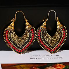 Adorn yourself in the Bohemian Antique Bronze Earrings—a fusion of bohemian allure and ethnic grace. These gold drop earrings boast intricate geometric patterns, adding a touch of tribal charm. Handmade, elegant, and vintage-inspired, these 6.6cm long earrings are a lightweight 15.2g/pair, making them an ideal accessory for women and ladies. Indian Jhumka, Carved Pendant, Bronze Earrings, Jhumka Earrings, Earrings Women, Antique Earrings, Gold Drop Earrings, Geometric Patterns, Long Earrings