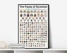 the faces of scramton poster on a shelf next to books and a vase