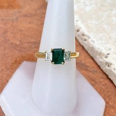 Vintage/ antique 18KT yellow gold emerald-cut Colombian emerald + diamond accent ring. Absolutely stunning and high quality ring which would be fantastic as an engagement, birthstone, or celebration piece. Size 9 Can be resized for an additional fee 1.25 CT plus natural, Colombian emerald Emerald measures: 7mm x 5.3mm Inclusions in stone, but deep color and saturation 2 natural, emerald-cut, natural diamonds VS clarity; H color diamonds .50 CTW diamonds Weight: 4.65 grams Estate condition. 1 Sid Emerald Cut May Birthstone Diamond Ring For Proposal, Three-stone Emerald Cut Emerald Ring For Anniversary, Heirloom Emerald Ring With Vvs Clarity, Heirloom Emerald Cut Emerald Ring With Vvs Clarity, Heirloom Three Stone Emerald Cut Emerald Ring, Heirloom Emerald Cut Vvs Clarity Emerald Ring, Three-stone Emerald Cut Emerald Ring For May Birthstone, Three Stone Emerald Cut Emerald Ring, Heirloom Asscher Cut Emerald Ring For Anniversary