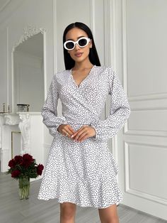 White Mini Wrap Dress with Bishop Sleeves    *SIZE OF ITEM:  S BUST    32,3 - 35,4 inches or 82 - 90 cm WAIST  25,2 - 27,6 inches or 64 - 70 cm HIPS     un  M BUST    33,9 - 37 inches or 86 - 94 cm WAIST  26,8 - 29,1 inches or 68 - 74 cm HIPS     un   *COLOR: Black     *MATERIAL: soft, consists of viscose and polyester *LINING: No *CLOSURE: Ties *MEASUREMENTS OF THE MODEL IN PHOTO/VIDEO: Model is wearing Size S, her height is 5,6 feet or 170 cm *HANDLING:  Hand wash or delicate wash,  water temp White V-neck Surplice Neckline Dress For Brunch, White Wrap Dress With Surplice Neckline For Spring, White Surplice Neckline Wrap Dress For Spring, White Long Sleeve Wrap Dress For Brunch, Chic White Wrap Dress With Surplice Neckline, White Mini Dress With Surplice Neckline, White Surplice Neckline Mini Dress For Spring, White Mini Dress With Surplice Neckline For Spring, Fitted White Casual Wrap Dress