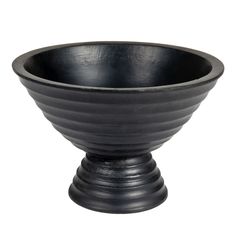 a black bowl sitting on top of a white table