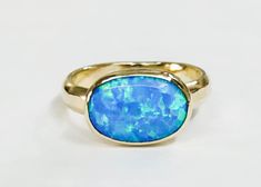 14k yellow gold ring with oval opal stone The opal stones are setting in 14k gold bezel. It is impressive, powerful and very beautiful ring. This ring can be made to order in any size. Please note your desired size in the message to seller area at checkout. size stone is 10 mmX 14mm width ring: 4 mm It will take to me 1 week to make your order and send her to you... Come in a gold gift box. Fallow me on facebook for newest updates. http://www.facebook.com/pages/Orit-Naar-jewelry/174677569247132? Oval Cabochon Opal Ring With Polished Finish, Polished Opal Ring In Oval Cabochon Shape, Opal Oval Cabochon Ring With Polished Finish, Classic Oval Opal Ring With Bezel Setting, Oval Opal Rings With Polished Finish, Classic Oval Bezel Set Opal Ring, Polished Opal Oval Cabochon Ring, Fine Jewelry Oval Opal Ring With Polished Finish, Oval Opal Rings With Bezel Setting