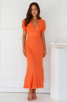 Length from shoulder to hem of size S: 146cm. Chest: 46cm, Waist: 32cm, across front only of size S. Maxi dress. Lined. Model is a standard XS and is wearing size XS. True to size. Non-stretch. Elastic cuffs to sleeves. Cutout to back with elastic. V-neck. Button closure at back of neck. Zipper with hook eye closure. Cold hand wash only. Polyester. Long summer days done right in the Gilded Maxi Dress. Featuring elastic cuffs to the sleeves, a cutout to the back, and a gorgeous V-neck. Style with First Day Outfit, Shower Dresses, Jumpsuits And Romper, Dress Orange, Graduation Outfit, Long Sleeve Lace Dress, Dresses Backless, Dress Cuts, Hook Eye