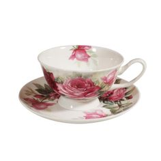 a cup and saucer with pink roses on it