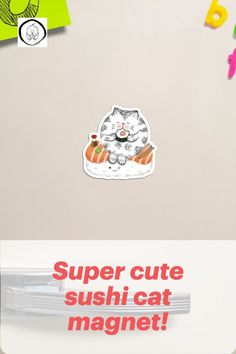 a cat sticker sitting on top of a refrigerator