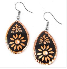 Elegant, handcrafted, cooper engraved Turkish earrings.  These Turkish handmade earrings are a perfect gift for someone special. Crafted from high-quality copper, they feature an intricate engraving that adds a touch of beauty to any outfit. The earrings are perfect for those who appreciate unique and exquisite jewelry pieces. The earrings are designed with a focus on beauty and elegance, making them a great addition to any jewelry collection. The engraved design adds a touch of sophistication t Engraved Metal Earrings As Gift, Engraved Metal Earrings For Gift, Hand Tooled Teardrop Earrings For Gift, Unique Hand-painted Copper Jewelry, Unique Hand Painted Copper Jewelry, Unique Copper Earrings As Gift, Unique Copper Earrings For Gift, Bronze Etched Earrings For Gift, Handmade Black Copper Earrings