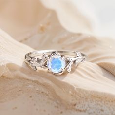 "One of a kind engagement ring for a woman" - that is what comes to mind when you see this ring. We absolutely believe that your partner will fall in love with this piece, the same way our women's team falls in love with it. This unique ring is comfortable and has a 6 mm main gemstone. The most distinctive feature of moonstone is its adularescence, a phenomenon that creates a glowing, milky sheen on the surface, reminiscent of moonlight. Moonstone is one of the birthstones for June. Jewelry come Fine Jewelry Birthstone For Proposal, Fine Jewelry With Birthstone For Proposal, Elegant Solitaire Jewelry For Proposal, Fine Jewelry For Proposal With Birthstone, Diamond Birthstone Jewelry For Proposal, Dainty Diamond White Ring For Proposal, 14k White Gold Topaz Birthstone Promise Ring, Elegant Oval Jewelry For Promise Ring, Dainty Sterling Silver Promise Jewelry