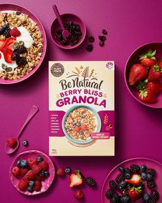 bowls of granola, berries and yogurt on a purple surface with spoons