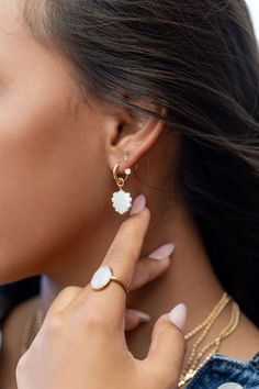 The Lanikai Hoops reflect Hawaii's natural abundance and beauty. These small gold mother of pearl and gold huggie hoop earrings feature darling carved seashell charms. These pretty gold hoops are perfect solo or teamed with our other mini hoops. Handmade on Maui, Hawaii. ✦ DETAILS ✦ ✧ Name: Lanikai (LAH nee kaee) - heavenly ocean. ✧ 18kt Gold Vermeil. ✧ 30mm Drop Length ✧ 12mm hoop outer diameter, 9mm inner diameter, & 2.5mm hoop thickness. ✧ All Ke Aloha Jewelry pieces come packaged thoughtfull Gold Daisy Earrings, Hoops With Charms, Gold Huggie Hoop Earrings, Daisy Earrings, Jewelry Lookbook, Initial Jewelry, Maui Hawaii, Huggie Hoop Earrings, Dream Jewelry