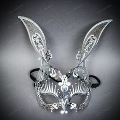 Step Into The World Of Enchantment With The Bunny Rabbit Metal Laser Cut Silver Rhinestones Masquerade Mask With Sexy Long Eye Lashes In Shinny Silver. This Exquisite Mask Perfectly Combines Playful Charm And Elegant Sophistication, Making It An Ideal Choice For Masquerade Parties, Costume Events, Or Themed Gatherings. Crafted With Precision Laser Cutting, This Metal Mask Features Intricate Designs That Emulate The Delicate Features Of A Rabbit, Including Pointed Ears And A Contoured Face Shape. Owl Mask Masquerade, Rabbit Masquerade Mask, Bunny Masquerade Mask, Masquerade Mask Design, Mask For Masquerade, Fancy Mask, Elegant Mask, Contoured Face, Silver Masquerade Mask