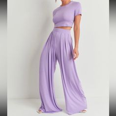 This Fashionable 2-Piece Outfit Will Have Anyone Looking And Feeling So Great In Their Body While Wearing It. It’s Beautiful Purple Color Will Allow You To Style It With Any Leather Or Cropped Jacket. Trendy Solid Color Wide Leg Sets, Casual Two-piece High Waist Set, Casual High Waist Two-piece Set, Casual High-waisted Two-piece Set, Purple Relaxed Fit Sets For Spring, Trendy Two-piece Solid Color Bottoms, Casual Stretch Cropped Sets, Trendy Stretch Wide Leg Sets, Trendy Solid Two-piece Bottoms