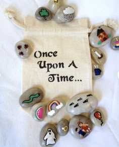 there is a bag with rocks on it and the words, once upon a time