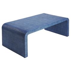 a large blue bench sitting on top of a white floor