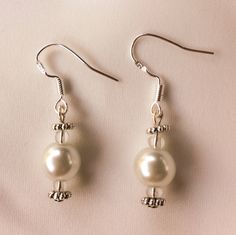 Elegant pearl bridal sterling silver earrings. Wedding, Bridal jewelry, bridesmaids gift, bridal earrings. Classic Silver Bridal Earrings For Formal Occasions, Elegant Silver Bridal Earrings With Pearl Charm, Silver Round Pearl Embellished Earrings, Classic Sterling Silver Pearl Earrings With Elegant Design, Classic White Bridal Earrings With Elegant Design, Classic Silver Jewelry For Mother Of The Bride, Silver Pearl Wedding Earrings, Elegant Silver Bridal Earrings With Pearl Drop, Elegant Silver Pearl Drop Bridal Earrings