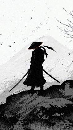 the silhouette of a man with a hat and long cane walking up a hill in front of a snow covered mountain