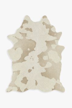 a white and brown cowhide rug on a white background with an animal print pattern