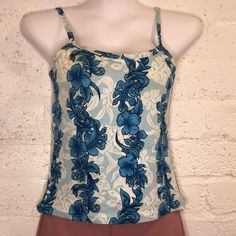 Cute Little Tank Top With A Few Problems In The Form Of Light Stains. Looks Like Discoloration Due To Aging But It Is Barely Noticeable Due To The Floral Designs And Colors. Priced Accordingly. See Pictures. Size Runs Small With 2-4” Of Stretch. 100% Cotton. Fine For A Beach Or Workout Top. Pit To Put 15.5” Hem Width 15.5” Length 14.5” From Front Neck To Hem Hawaii Tank Top, Plain Tank Tops, Sheer Tank Top, Orange Tank Top, Halter Tank Top, High Neck Tank Top, Purple Tank, Yoga Tank Tops, High Neck Tank