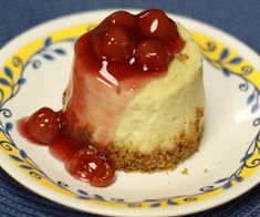 a piece of cheesecake with cherries on top