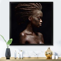 a woman with braids on her head in front of a black and gold wall