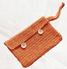 Looking for a unique accessory that adds a touch of sunshine to your outfit? Do not search anymore ! Discover this magnificent raffia pouch (straw/paper thread), carefully handcrafted. 🌟 Bag Features: - Handmade with raffia (straw yarn/paper)/crochet - Color: bright and warm orange - Original and summery design - Dimensions: height 16 cm width 24 cm - Perfect for all your outings, whether casual or elegant Handmade Straw Crochet Pouch Bag, Crochet Straw Pouch Bag For Beach, Crochet Pouch Straw Bag For Beach, Beach Crochet Jute Pouch Bag, Beach Jute Crochet Pouch Bag, Handwoven Jute Crochet Pouch Bag, Orange Woven Crochet Bag For Vacation, Eco-friendly Jute Crochet Bag For Gift, Orange Crochet Bag For Beach