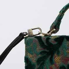 With a nod to the Victorian era, MCW’s freshly combines the classic and elegant design of the traditional carpet satchel with a textural and tactile twist.A perfect blend of style and practicality. Spacious interior with zipper and slip pockets, detachable shoulder strap. Sturdy exterior in carpet or velvet, cotton lining. Convenient magnetic flap closure, brass feet for stability.Features: • Detachable, adjustable shoulder strap • Magnetic flap for easy access • Interior slip and zipper pockets • Hand-polished brass hardware • Includes dust bagDimensions: • Satchel size: 9.50”W x 4”D x 8”H • Adjustable shoulder strap: 43.50” to 51.15”Interior Pockets: • Zipper pocket: 7”W x 5”H • Slip pocket: 8”W x 5.50”HWeight: 1lb 5oz / 590gThis exquisite satchel is the perfect companion for your daily Traditional Carpet, Burnout Velvet, Secret Sale, New Launch, Weekend Getaway, Jade Green, Brass Hardware, Victorian Era, Blazers For Women