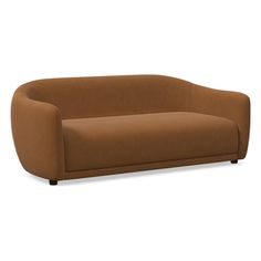 a brown couch sitting on top of a white floor