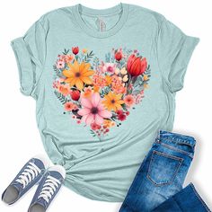 Style: Add some sunshine to your wardrobe with our stylish flower shirts for women! These graphic tees for women are the perfect blend of style and comfort and are sure to add some fun and fashion to your attire. Quality: Our nature lover tops for women are designed and printed with love in the USA. We use high-quality inks on our premium Bella Canvas unisex sunflower tshirt for a bold and stylish look. Fabric: Our womens tops are crafted with a premium blend of 100% Airlume combed and ring-spun Relaxed Fit Heart Print T-shirt For Summer, Casual Heart Print T-shirt For Spring, Spring Short Sleeve Top With Heart Graphic, Spring Heart Print Crew Neck Tops, Spring Tops With Heart Print And Relaxed Fit, Relaxed Fit Heart Print Tops For Spring, Heart Print Tops With Relaxed Fit For Spring, Spring Heart Graphic T-shirt, Spring Graphic Tee With Heart Design