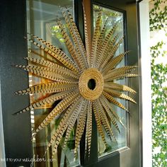 a decorative sunburst is hanging on the front door to give it a touch of nature