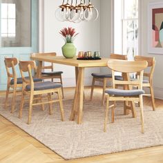 a dining room table with chairs around it