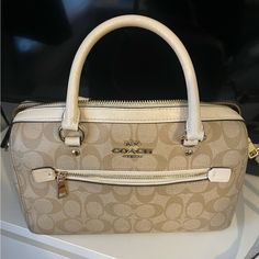 Coach Bag In Good Used Condition. Some Minor Marks / Signs Of Wear Shown In Photos. Original Price Of Bag $385. The Going Rate For This Bag Is About $150-300 I Am Open To Offers! This Bag Is A Light Brown/Tan/Beige Cream Color With White/Off White Accents. With The Classic Coach “C” Logo All Around. White Coach Bag, White Accents, Coach Bag, Dream Clothes, Coach Bags, Cream Color, Light Brown, Satchel, Bag Lady