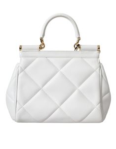 The Dolce & Gabbana White Quilted Sicily Bag is made of 100% Calf Leather and features gold metal detailing. It can be carried as a satchel or worn over the shoulder with the detachable strap. The bag has a magnetic closure and a black inner lining. Inside, there is one pocket with zipper closure and logo details. The bag is made in Italy and measures 20cm x 17cm x 10cm, with a strap length of 105cm x 1cm. Model: SICILY Shoulder bag Material: 100% Calf Leather Color: White with gold metal detail Sicily Bag, Engraved Metal, Metal Engraving, White Quilt, Backpack Tote Bag, Designer Shoulder Bags, Boot Bag, Satchel Bag, Wedge Boots