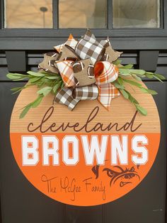 the cleveland browns sign is decorated with leaves and bows