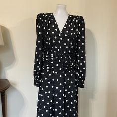 "Designer Black and White Polka Dot midi dress by Derek Lam...The  Classic midi dress has a fluid fit and features padded puff shoulders with an outside seam detail, V-neckline, long sleeves with button cuffs, and slight shirred cummerbund style waist with a gathered front detail and flowy skirt... Excellent condition with no issues....Original Price $595 Brand Label: DEREK LAM 10 CROSBY Material: 100% Polyester MEASUREMENTS Label Size 8 ...Measurements taken with Garment Flat UN Stretched...Tak Chic Polka Dot Knee-length Midi Dress, Polka Dot Midi Dress For Formal Occasions, Formal Polka Dot Midi Dress, Polka Dot Midi Length Workwear Dresses, Polka Dot Midi Dress For Work, Polka Dot Midi Length Dresses For Work, Polka Dot Knee-length Workwear Dress, Knee-length Polka Dot Workwear Dress, Knee-length Polka Dot Dress For Work