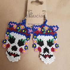 Celebrate Day of the Dead all year long with these delightfully spooky earrings. Hand-beaded in Guatemala under Fair Trade principles. Your purchase helps support our artisan partner's traditional crafts. Handmade Earrings For Day Of The Dead, Beaded Dangle Earrings For Halloween, Handmade White Earrings For Halloween, Dangle Beaded Earrings For Halloween, Whimsical Handmade Multicolor Beaded Earrings, Whimsical Multicolor Handmade Beaded Earrings, Handmade Whimsical Multicolor Beaded Earrings, Adjustable Beaded Earrings With Bead Caps As Gift, Whimsical Adjustable Beaded Earrings