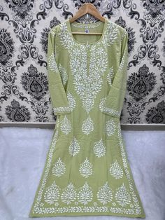 A ready to wear kurta dress in two colours. Light Purple and Light leafy green Elevate your wardrobe with our sustainable and eco-friendly Chikankari Kurta in Modal Cotton fabric. This beautiful dress features intricate hand embroidery that adds a touch of elegance and sophistication to your style. The Modal Cotton fabric ensures comfort and breathability, making it perfect for any occasion. Our artisans have created this piece with great care and attention to detail, ensuring that it will last Green Cotton Long Sleeve Salwar Kameez, Spring Cotton Salwar Kameez In Pista Green, Pista Green Long Sleeve Cotton Salwar Kameez, Unstitched Pista Green Cotton Dress, Embroidered Cotton Dress In Pista Green, Casual Salwar Kameez With Dabka, Pista Green Cotton Salwar Kameez With Floral Embroidery, Pista Green Embroidered Cotton Dress, Embroidered Pista Green Cotton Dress