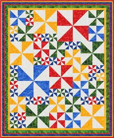 a colorful quilt with many different colors and shapes on the front, along with an orange border