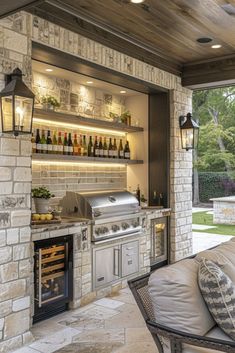 an outdoor kitchen with grill, oven and wine bottles on the shelves above it's door