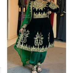 afghan kuchi traditional wedding drees is made of good quality long lasting fabric. Traditionally such Afghanistan Persian Pashtun new design frocks are used as bridal dress. Most of girls also like and recommend such dresses for wedding, Nikkah and Mehndi night events. The dress measurements are kept average. If you need this frock in exact measurements you need, then please send us measurements which best fit on your body Gold Dress With Dabka Work, Anarkali Dupatta With Gold Embroidery For Traditional Ceremonies, Gold Dress With Dabka Work On Shantoon, Gold Shantoon Dress With Dabka Work, Green Bollywood Dress With Intricate Embroidery, Bollywood Style Green Embroidered Dress, Green Bollywood Embroidered Dress With Intricate Embroidery, Gold Anarkali Dress In Shantoon, Bollywood Green Dress With Intricate Embroidery