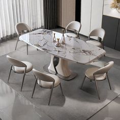 a marble dining table surrounded by white chairs