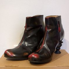 These Black Fluevog Boots Have Side Zippers, Red Accents, And Unique Sculptural Heels. They Have No Flaws And Are Like New. They Come With An Original Fluevog Holding Bag. Fluevog Boots, Sculptural Heels, John Fluevog Shoes, Fluevog Shoes, John Fluevog, Red Accents, Black Red, Black And Red, Like New