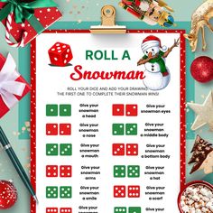 a roll a snowman game with dices and christmas decorations