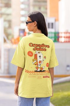 Creative Juice Retro Tshirt, Juice Box, 90s Nostalgia Shirt with a 2 Part Design on the Front and Back. Order a size or two up for an oversized look. We Offer Free UK Delivery! NOTE TO OUR CUSTOMERS We are a new business and very much appreciate your support! If you love your Tee as much as we hope you do, please leave us a review, thank you in advance- stay cosy and stay groovy! 💚 HOW TO ORDER 💚 1. Check our photos for sizing and colour options. 📏 2. Choose your quantity. Feel free to add as Oversized Y2k Tops With Cartoon Print, Trendy Oversized Top With Cartoon Print, Oversized Cartoon Print Crew Neck Top, 90s Style Printed T-shirt For Streetwear, Y2k Oversized Crew Neck Top, Oversized Y2k Crew Neck Top, Y2k Printed Crew Neck T-shirt, Retro Short Sleeve T-shirt With Cartoon Print, Relaxed Fit Cartoon Print Tops For Streetwear