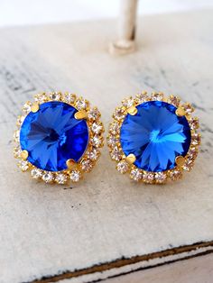 "Sapphire blue European crystal stud earrings, Bridal earrings, Bridesmaids gifts, gold or silver, crystal halo stud earrings, cobalt blue Lovely and chic. These earrings are so sweet and romantic. They would be great for bridal wedding or for any available other day. Perfect gift for bridesmaids or any available other occasion. They are made of 14k gold plated studs and crystals, all set in prong setting. Made with Premium quality European crystals. Sapphire blue surraounded by tiny clear cryst Gold Sapphire Earrings For Wedding, Royal Blue Jewelry For Wedding, Royal Blue Earrings, Earrings Sapphire, Bridesmaids Earrings, Beautiful Baubles, Blue Stud Earrings, Blue Wedding Shoes, Luxurious Fashion