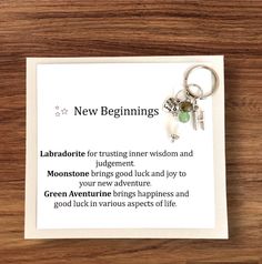 a card with a keychain that says new beginnings