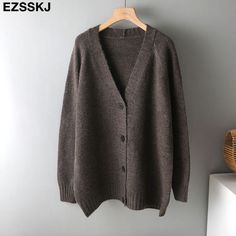 Brand Name: EzsskjStyle: High StreetThickness: STANDARDHooded: NoMaterial: CottonMaterial: PolyesterOrigin: CN(Origin)Season: Spring/AutumnPattern Type: SolidClothing Length: LongType: RegularGender: WOMENAge: Ages 18-35 Years OldCollar: V-NeckClosure Type: Single BreastedItem Type: Outerwear CoatsSleeve Length(cm): FullSleeve Style: RegularRelease Date: FW2021Outerwear Type: JacketsDecoration: ButtonDecoration: NONE Oversized V-neck Sweater Coat For Fall, Gray Knitted V-neck Outerwear, Winter V-neck Cardigan For Layering, Knit V-neck Sweater Coat For Winter, Winter Layering V-neck Cardigan, Cozy V-neck Sweater Coat For Winter, Oversized V-neck Cardigan, Spring V-neck Sweater Coat In Solid Color, Casual V-neck Sweater Coat For Layering