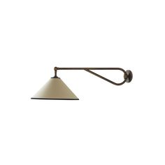 an old fashioned wall light with a white shade on the arm and black metal fittings