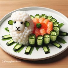 a white plate topped with sushi and cucumbers